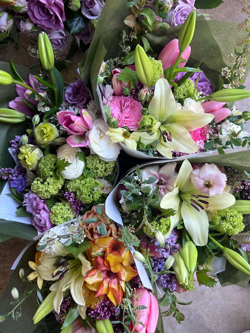 a group of Mother's day spring bouquets by Wild Child Flower Co. 