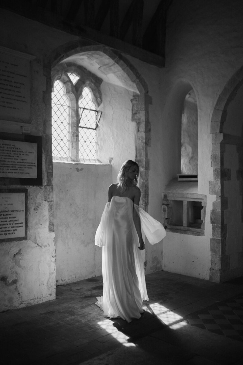 Long sleeved silk wedding dress with detachable sleeves by British bridal designer