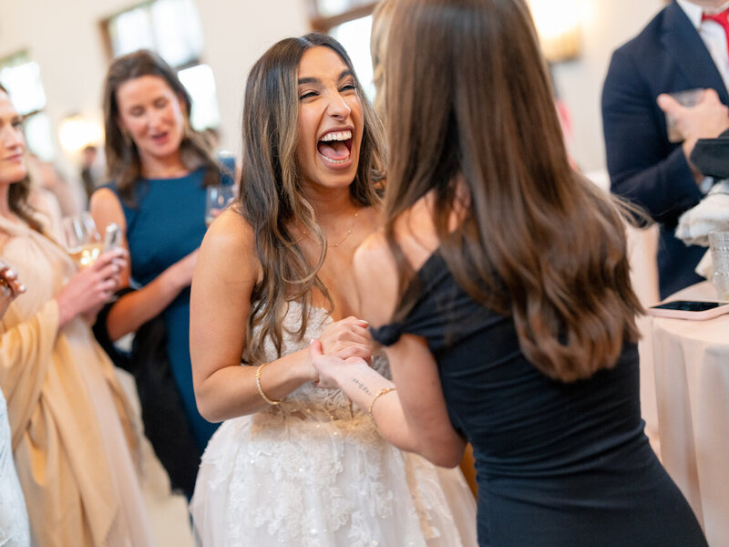 Candid cocktail hour moments on the lawn at Canyonwood Ridge wedding