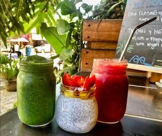 A colorful selection of fresh juice and smoothie drinks from Orangy Smoothies in Sayulita, made with natural ingredients for a healthy, refreshing boost.