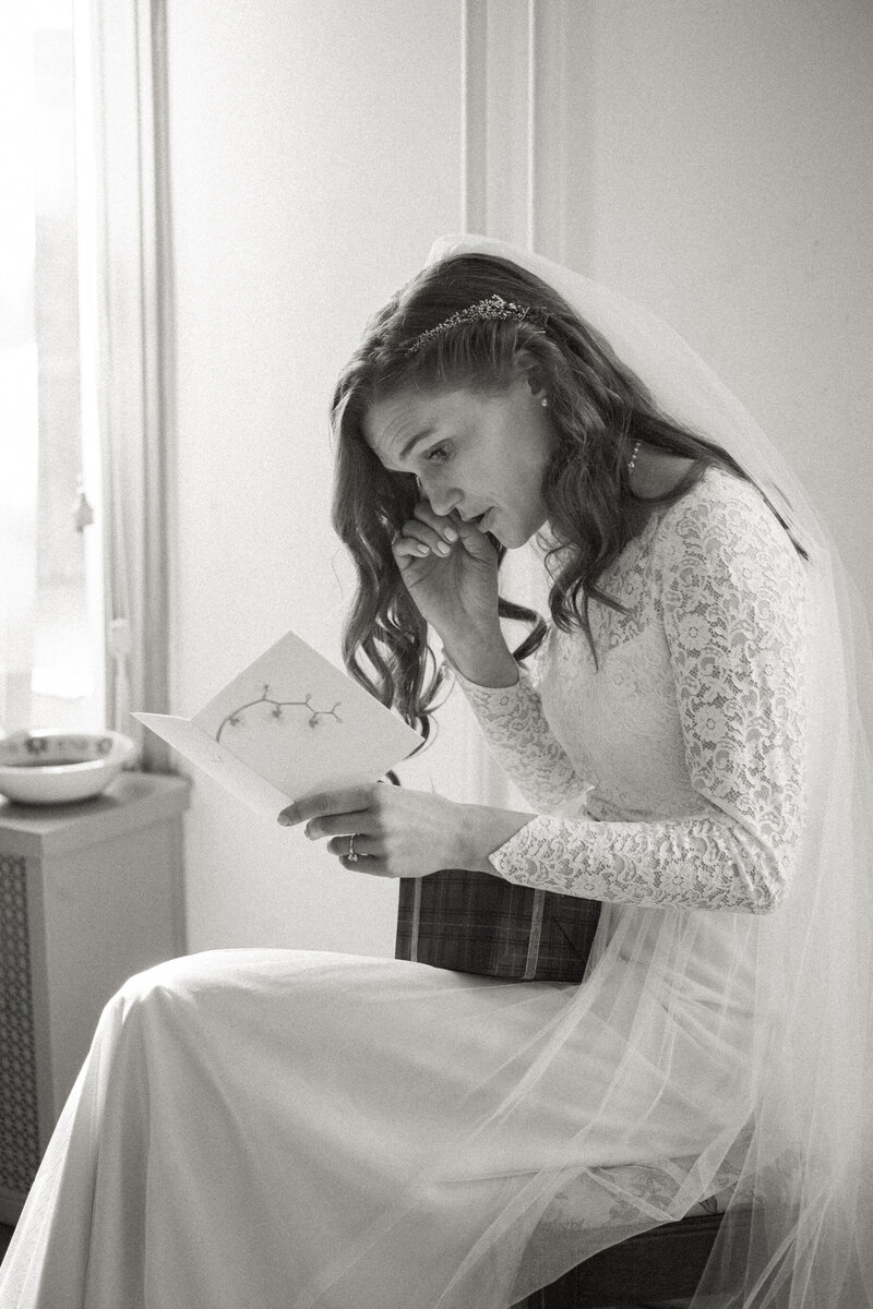 Bride reads a letter from his partner