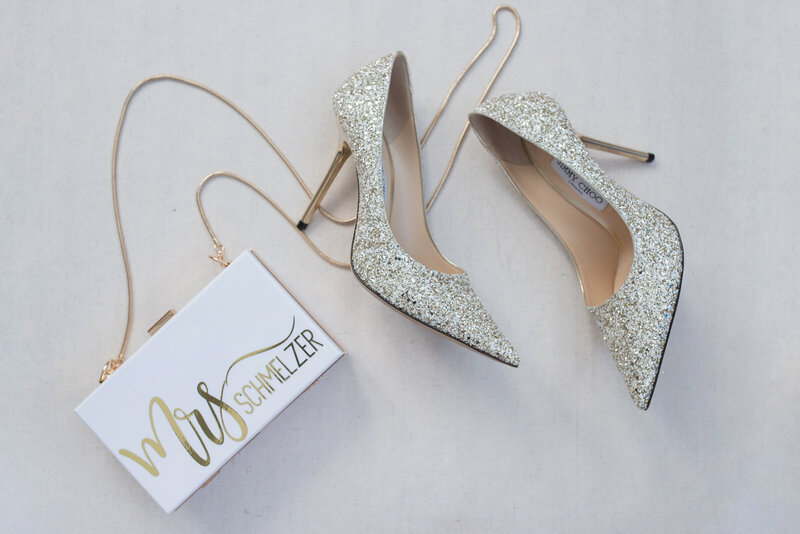 Brides purse and shoes for shore wedding.