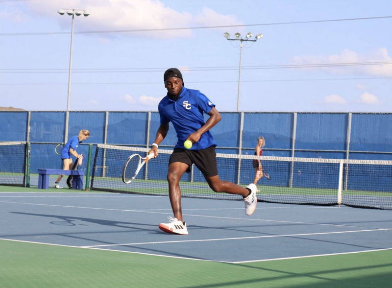 Personal trainers standing on road