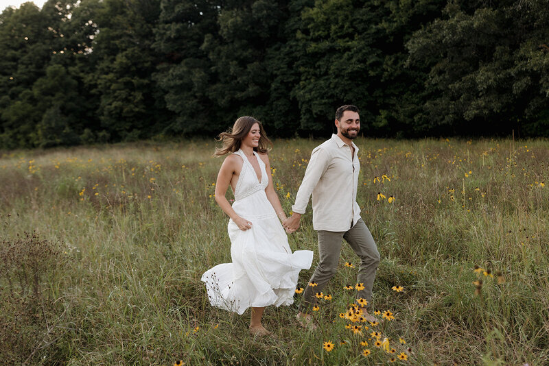 couple running through field