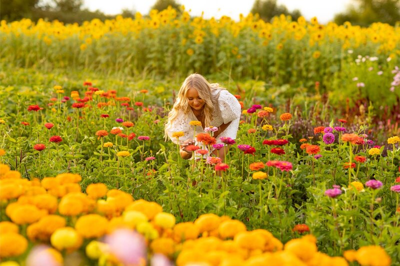 Girl picks flowers at a Bozeman flower farm.