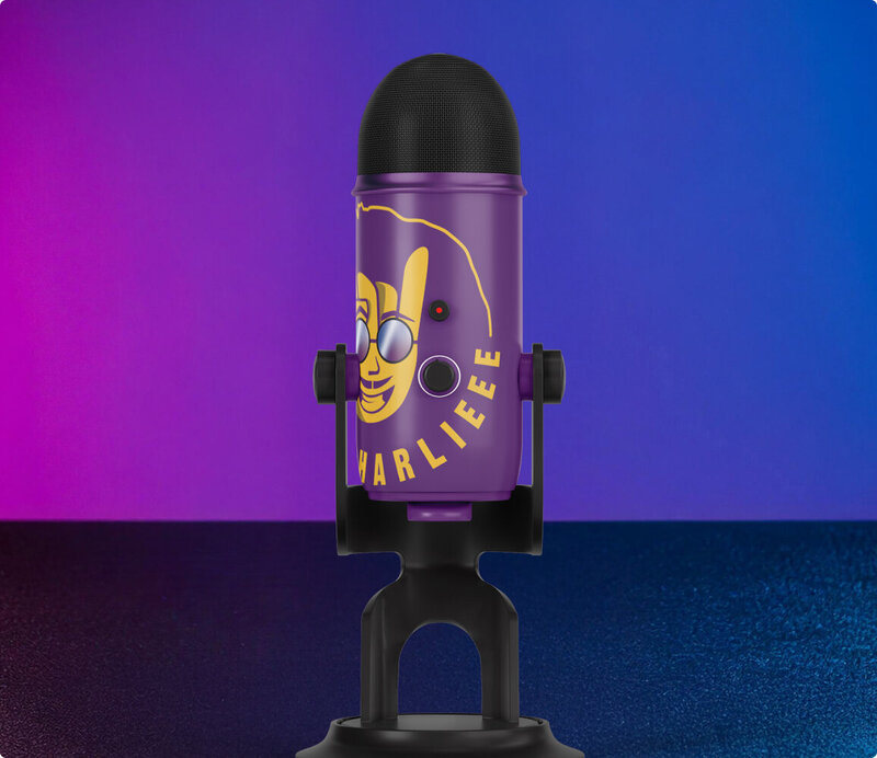 Purple microphone with Don Charlieee mascot sitting on a table.