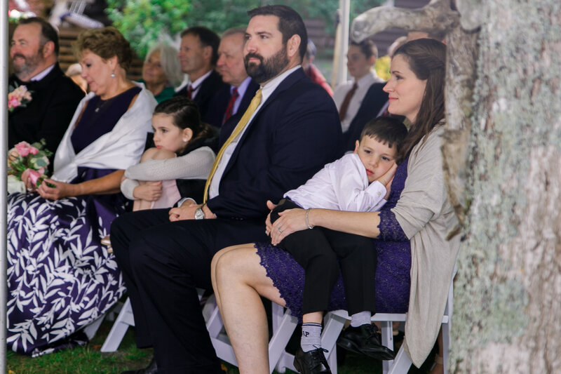 People sitting during ceremony | Wedding Photography