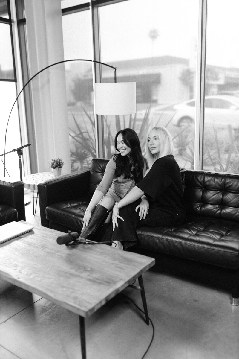 7 figure business mentor natasha zoryk laying in a modern chair and smiling