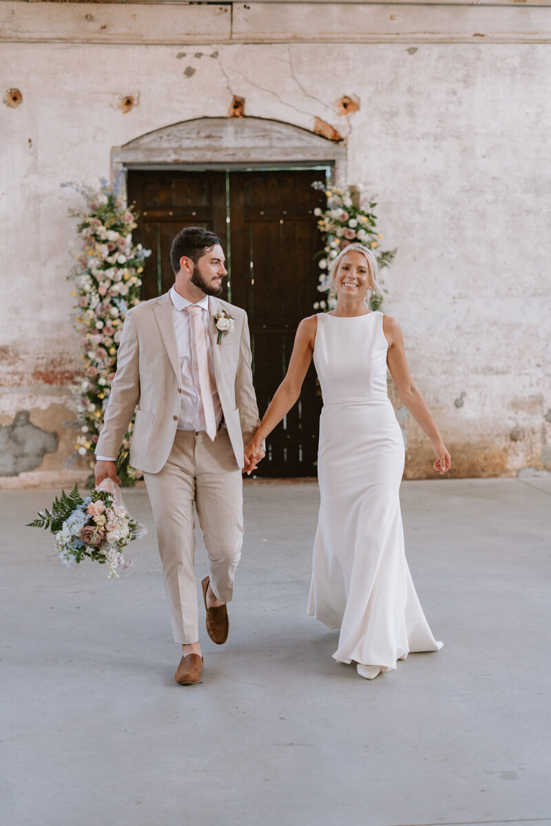 Bride and groom kissing at Providence Cotton Mill