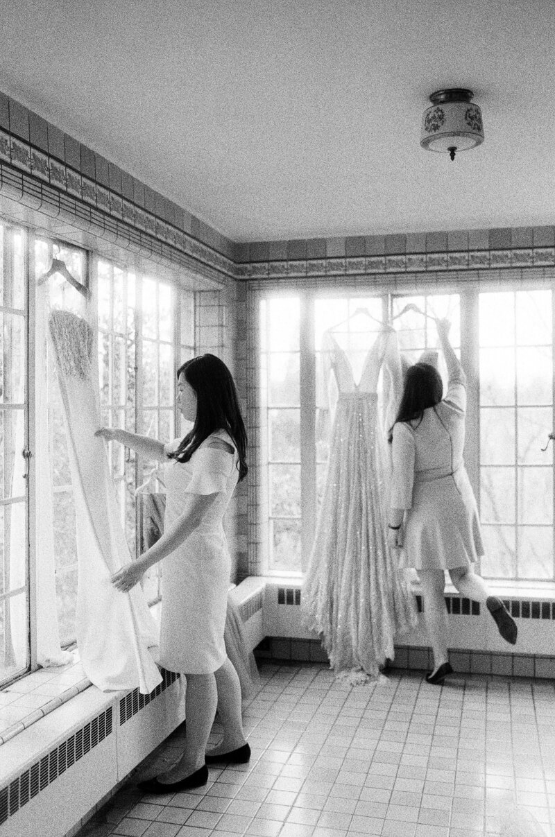 wedding planners hanging dresses at Hycroft