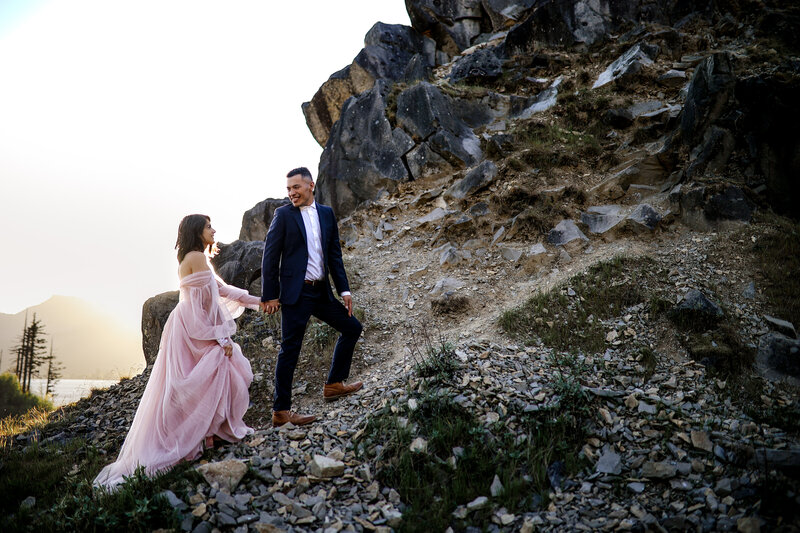 An adventurous elopement set against dramatic rock formations, glowing under the golden Pacific Northwest light.