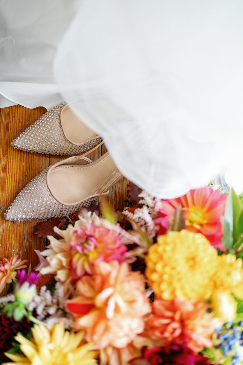 Bride’s gown and shoes with her vibrant bouquet, intimate elopement photography in Carolina Beach State Park