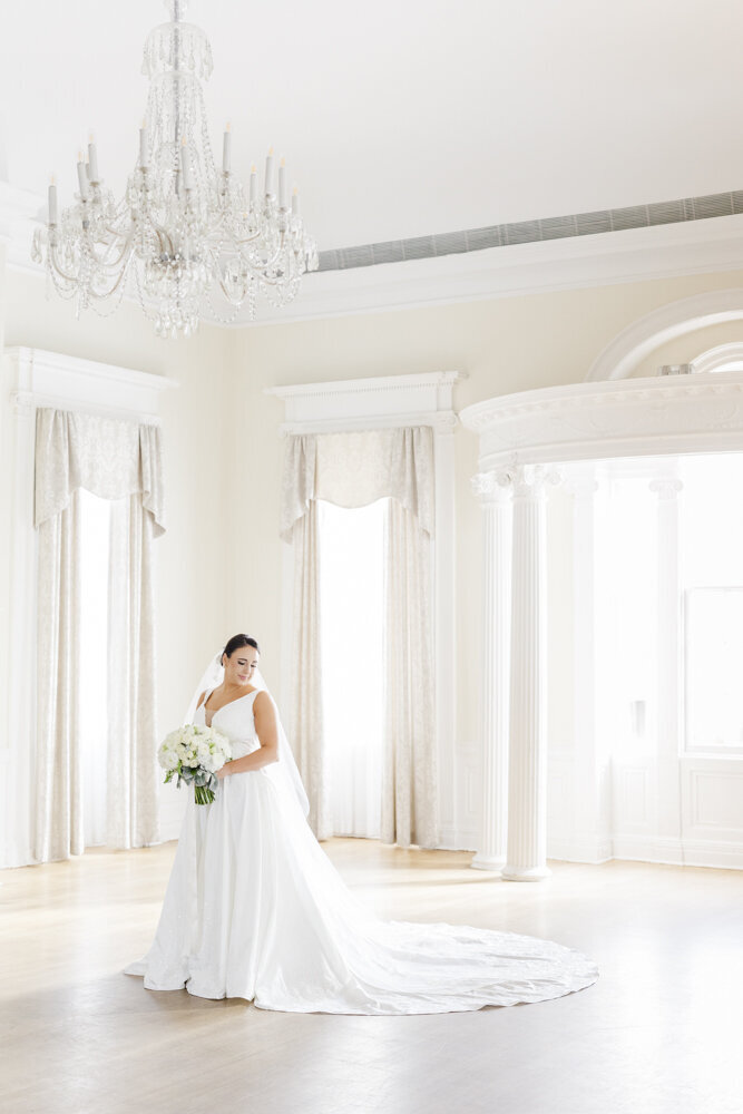 Light and airy photo of bride wearing a white gown