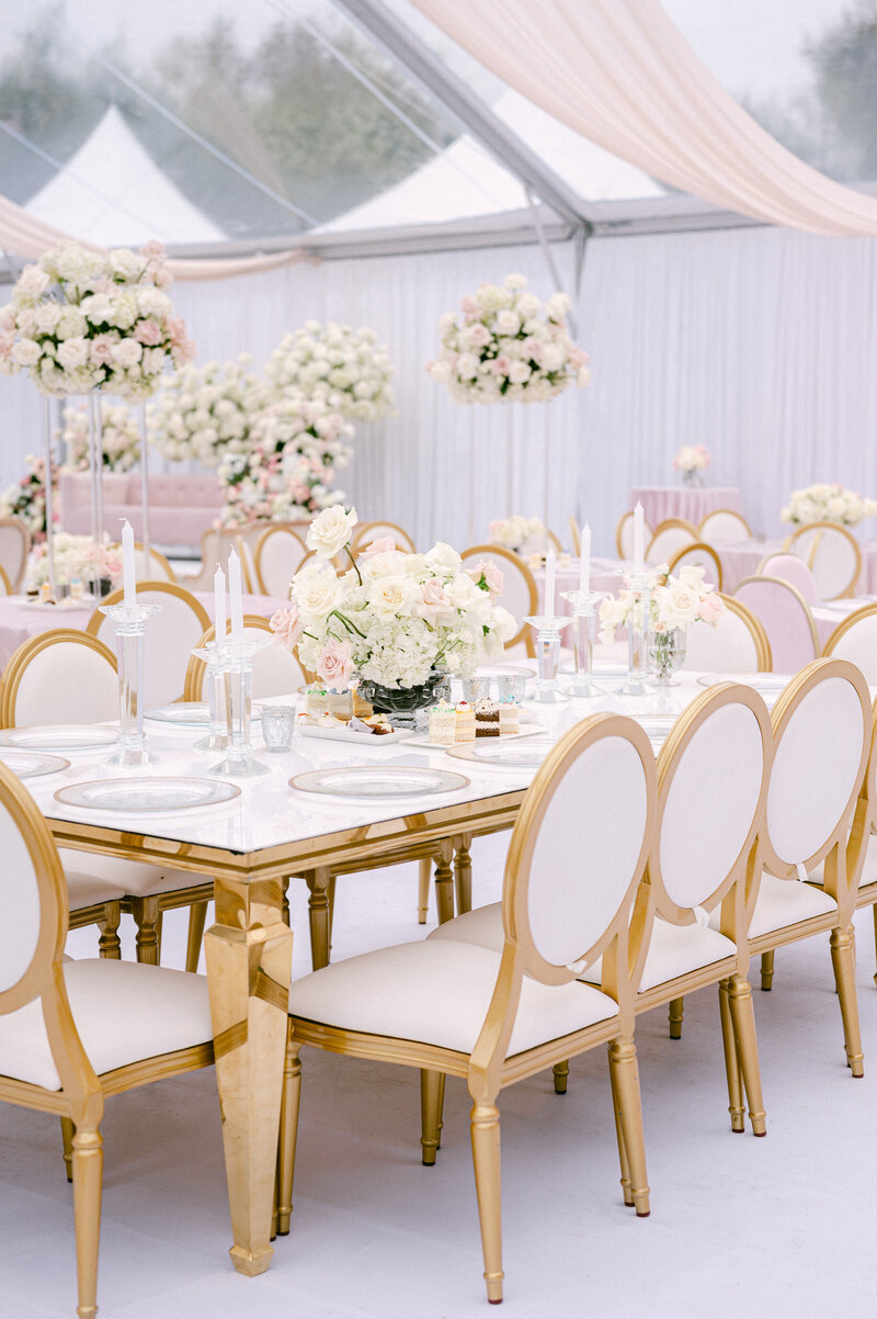 pink bridal shower arches decorated with white roses