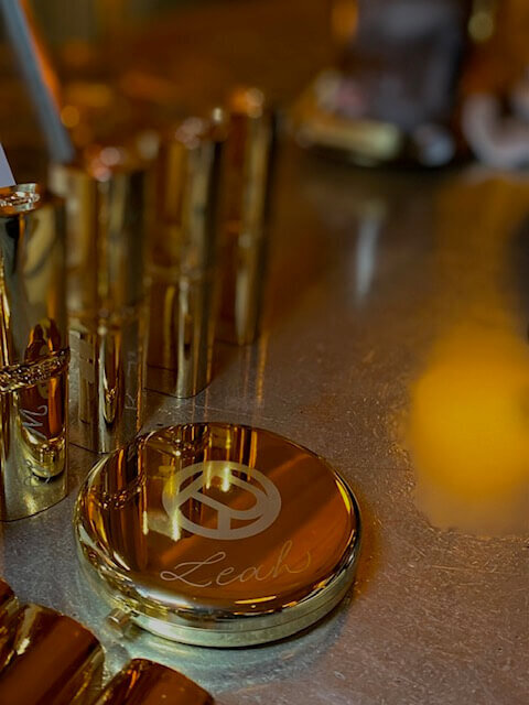 gold mirror with engraved name