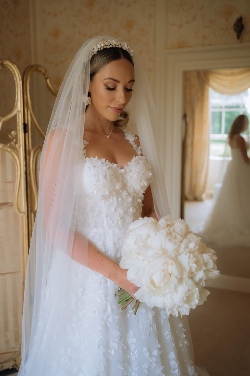 Bride with white Bouquet and Veil