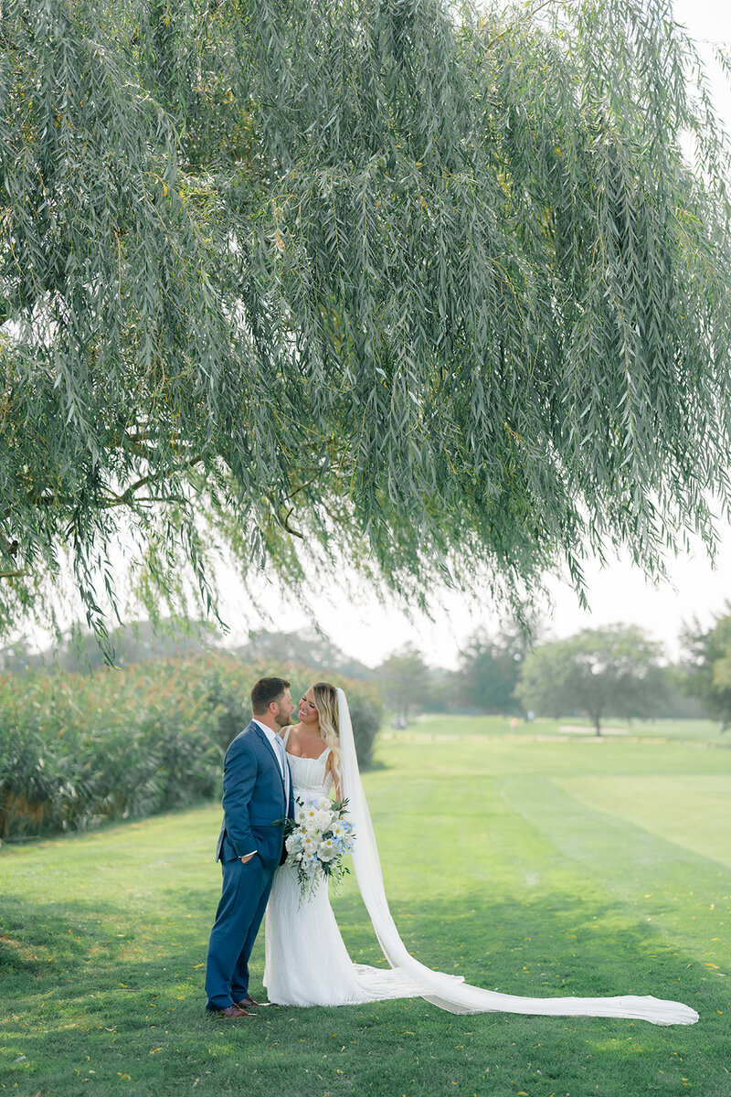 Bride and groom smiling  at timeless NJ wedding venue