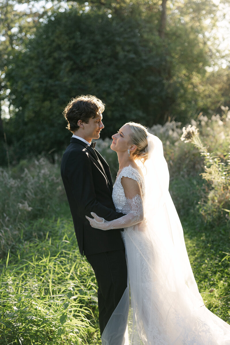 Bride and groom sharing a joyful moment on their wedding day, captured by a Madison wedding photographer.