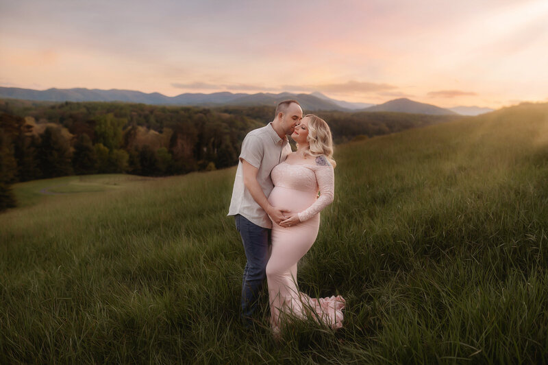 Expectant parents pose for Maternity Photoshoot in Asheville, NC.