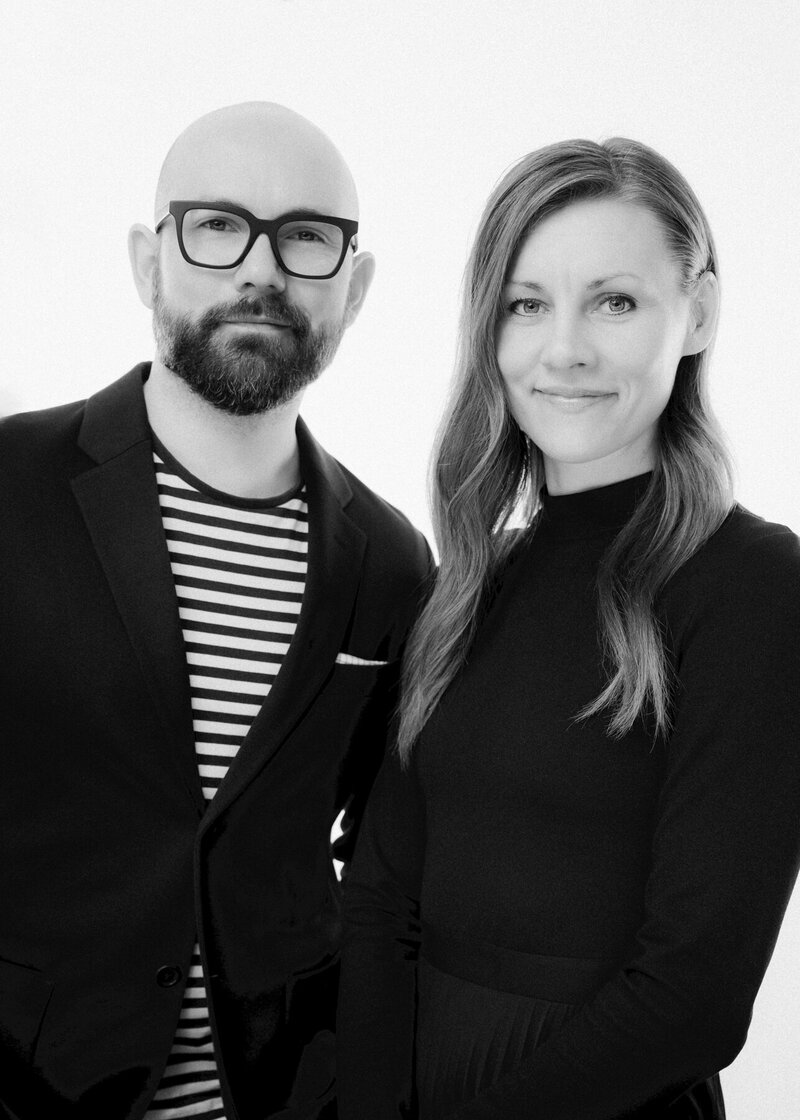 a black and white portrait of Alberta wedding photographers David and Breanne Heidrich at their Okotoks photography studio