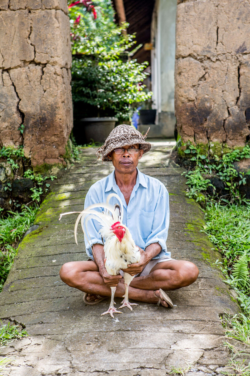 Balinese man with his rooster