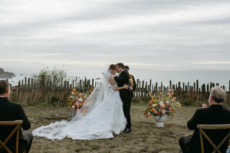 Bride and Groom kissing during their wedding ceremony in Mendocino, CA