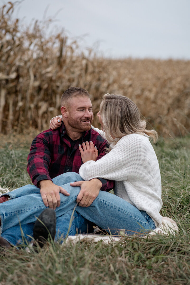 Couple cuddling during their lifestyle photography in ottawa