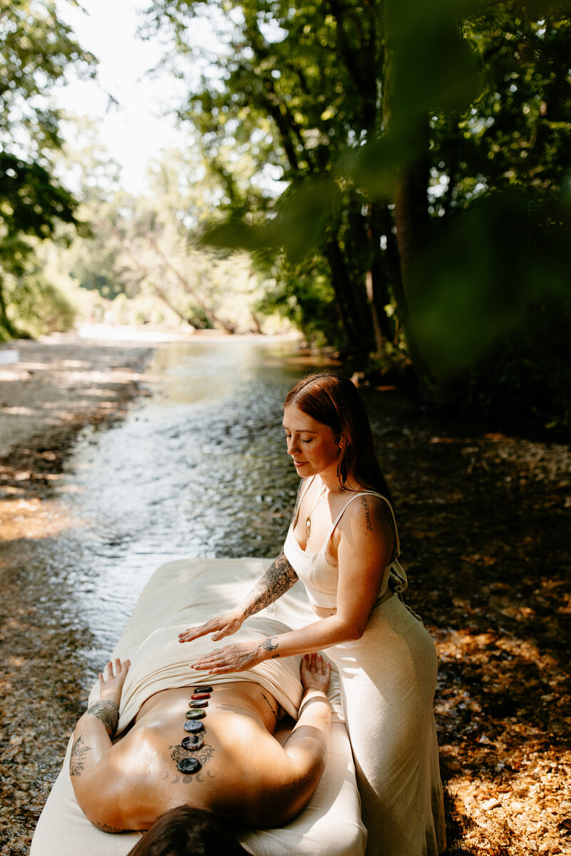 woman-giving-massage-in-nature