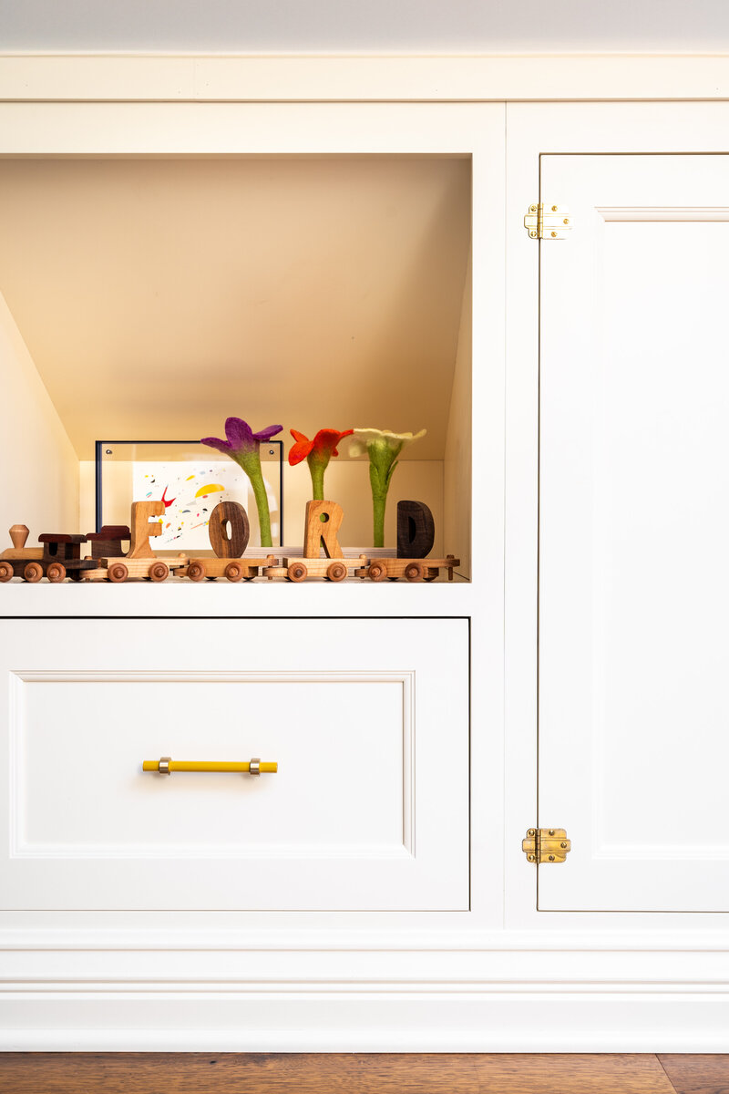 Brass black splash, white oak cabinets