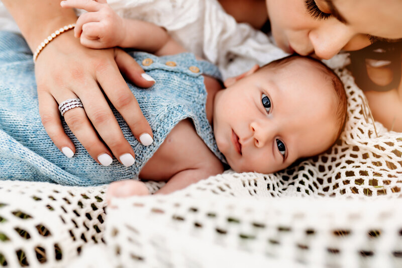 Newborn Photographer, Caucasian baby looking at the camera