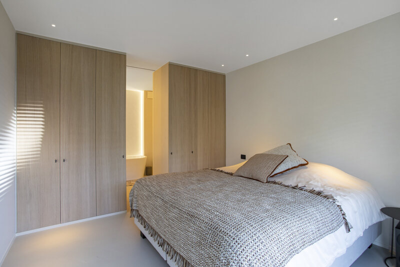 Hotelfotografie van luxueuze slaapkamer met badkamer ensuite