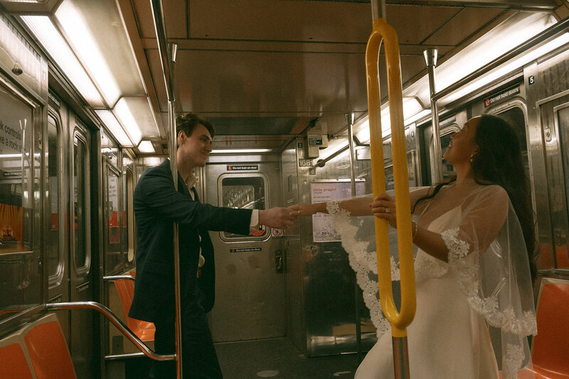 bride and groom on the subway before eloping shot by Elsie Goodman Photography | NYC Elopement Packages