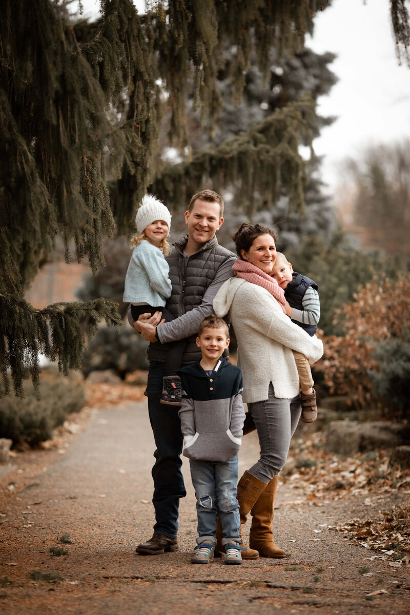 Minnesota family photographer, Kate Simpson, with her husband and three small children.