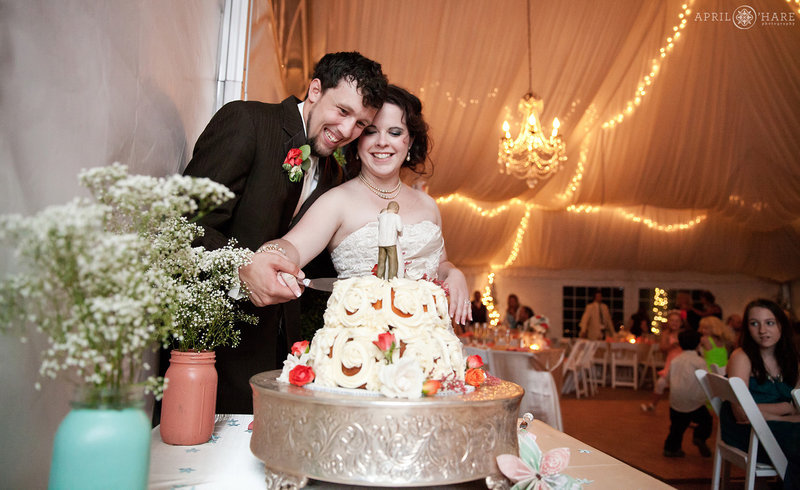 Cake cutting at The Manor House white Tent in Littleton CO