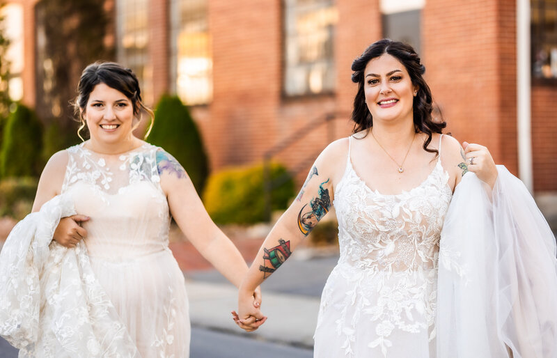 Brides holding hands after saying I DO, Rusty Rail Brewery PA Wedding