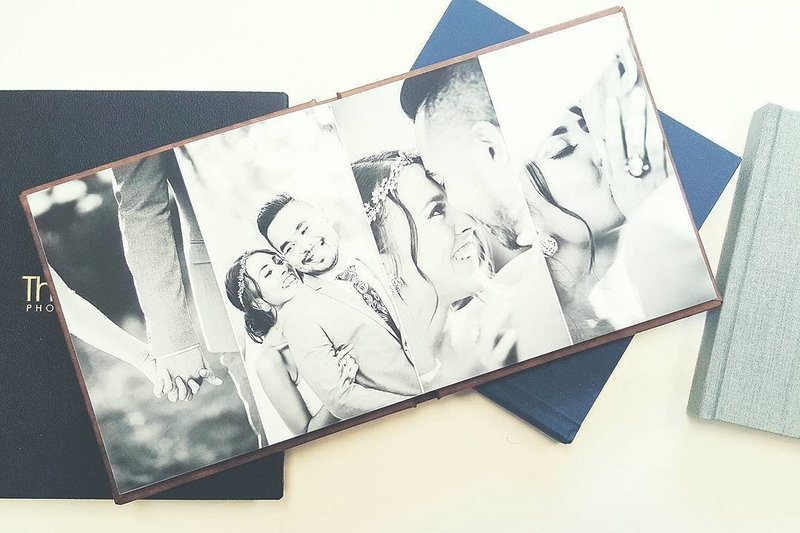 Open album book showing example of a wedding album