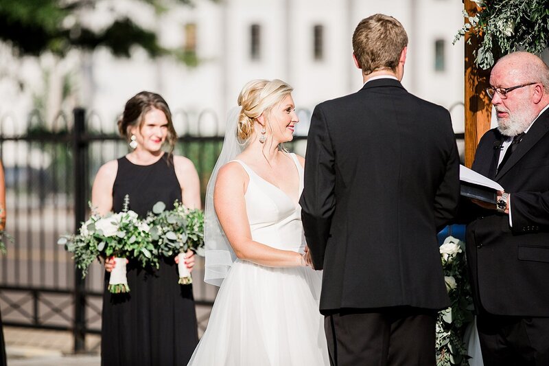 exchanging rings by Knoxville Wedding Photographer, Amanda May Photos