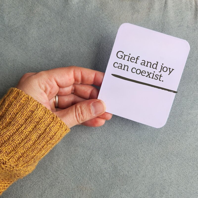 GRIEF CARD IN HAND