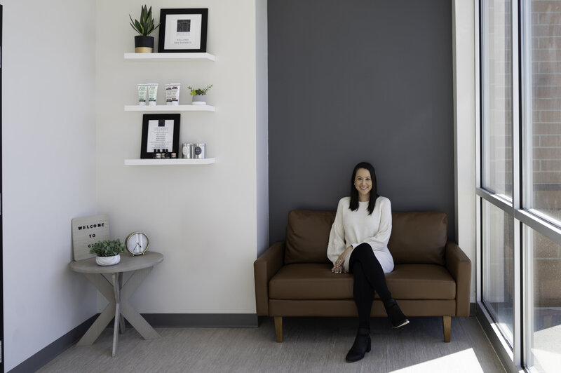 Doctor on couch in medical office for branding photography and social content
