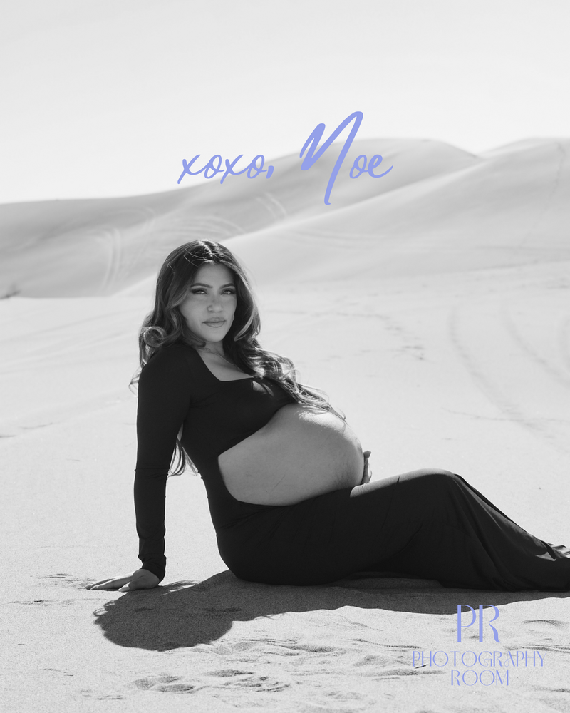 pregnant woman on sand dunes with Photographers logo over top 