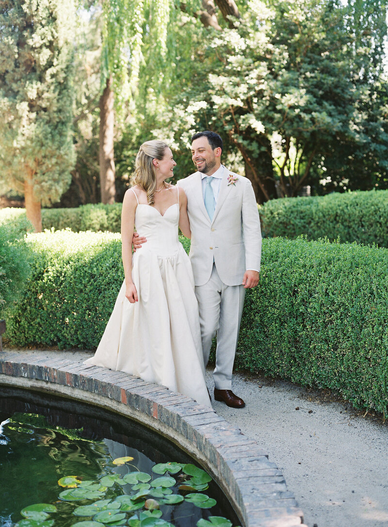 Bride and groom walk up memorial steps at their DC wedding
