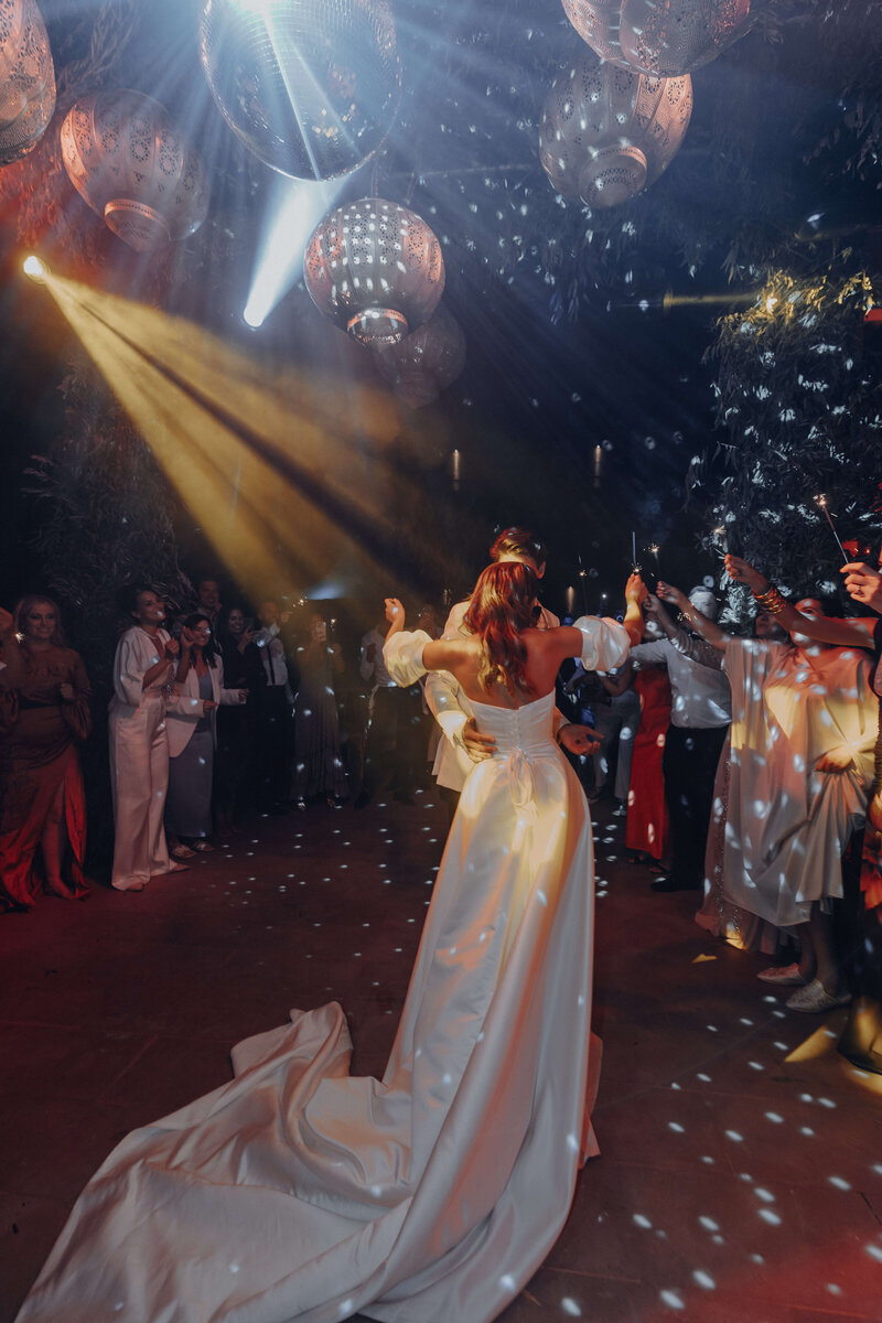 Couple dancing under lights