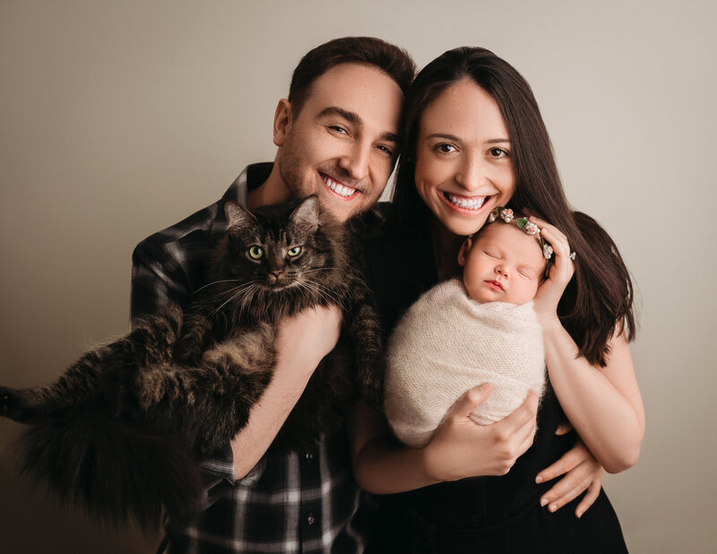New Haven Newborn Photographer  captures family with beautiful cat and newborn baby girl