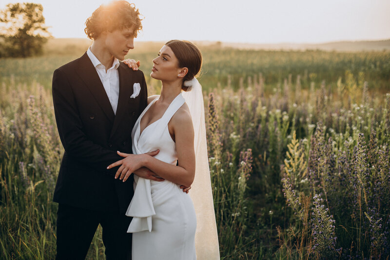young-wedding-couple-together-field