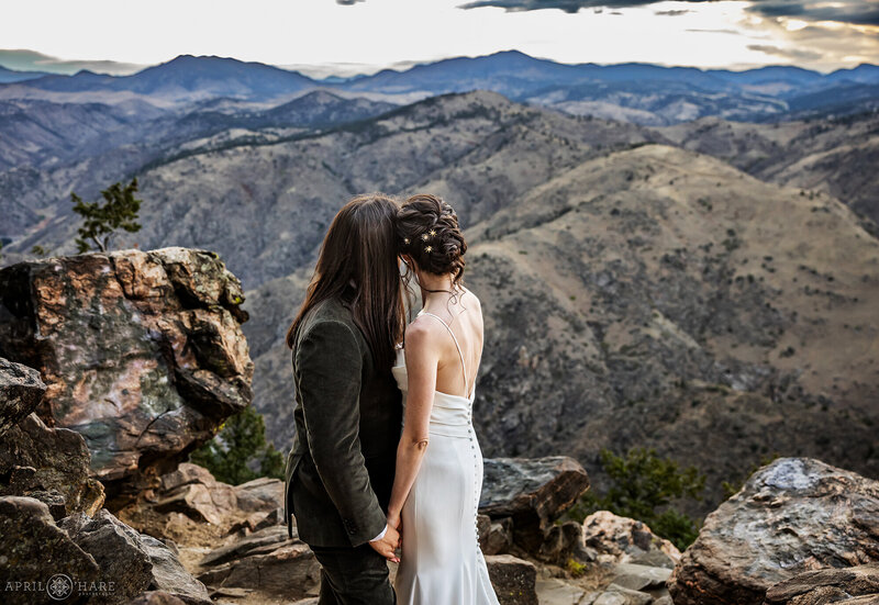 Couple look out at the pretty mountain views at their Boettcher Mansion Wedding on Lookout Mountain