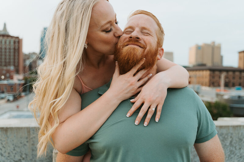 Downtown rooftop engagement photoshoot in Kansas City by wedding photographer Emma Leigh Photo.