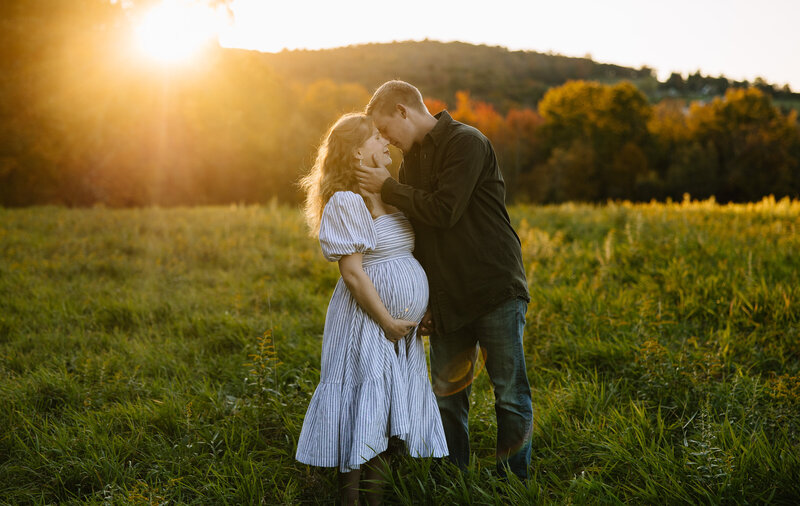 Bride and groom holding each other's faces and laughing