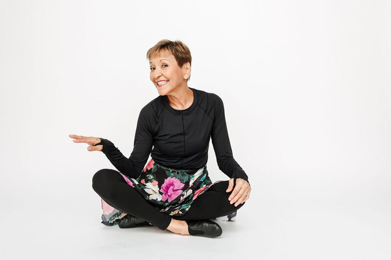 Melinda Fornero sitting crossed legged on floor