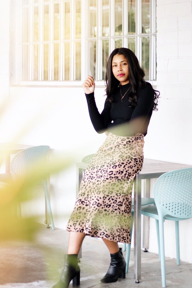 Modern Brand Photography featuring sunlit photo of young woman with leopard print skirt