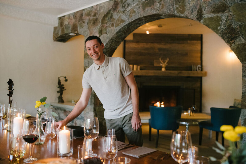 Young man setting the table for an intimate wedding